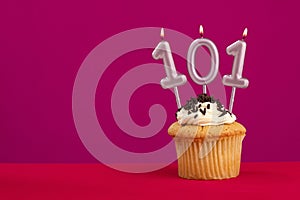Candle number 101 - Cake birthday in rhodamine red background