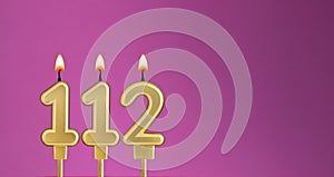 Candle number 112 in purple background - birthday card
