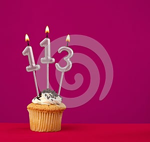 Candle number 113 - Cake birthday in rhodamine red background