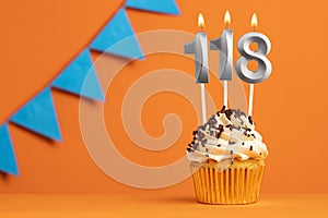 Candle number 118 - Cupcake birthday in orange background