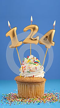 Candle number 124 - Cake birthday in blue background