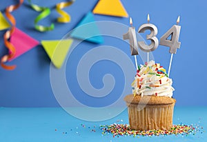 Candle number 134 - Cupcake birthday in blue background