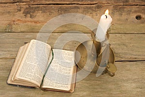 Candle and old prayer book