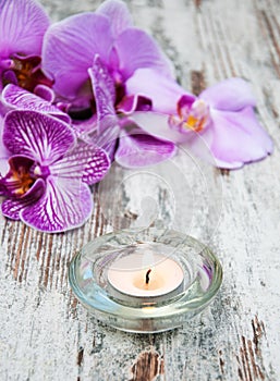 Candle with orchids