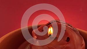 Candle red with red background with smoke in slow motion, 4k
