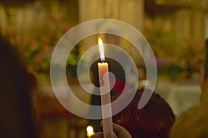 A candle in San Lazaro Catholic Church, El Rincon, Cuba, photo