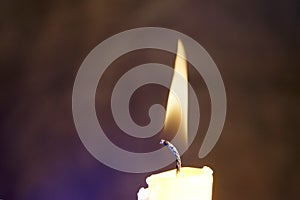 Candle with smoke and flame photographed in the studio with color foils before the flashes