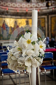 Candle. Special Decor for Baptism. The baptismal font and the priest table. Baptism ceremony