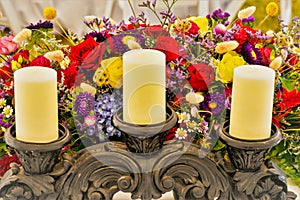 Candle stand and floral arrangement