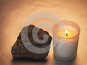 candle with stones related to spa or relaxation