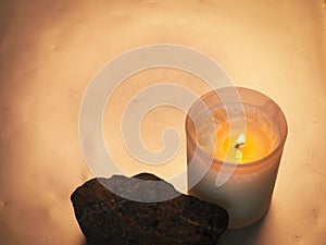 candle with stones related to spa or relaxation