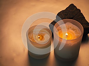 candle with stones related to spa or relaxation