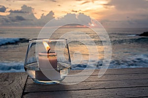 Candle on a table at sunset view cafe, at Sunset Point, Nusa Lembongan, Indonesia