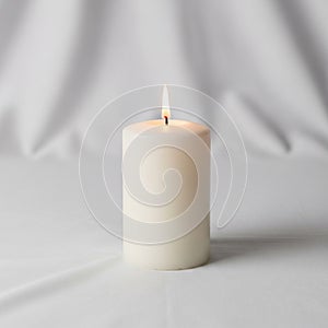 The candle is unadorned emphasizing its plain design and clean