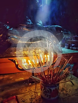 Candlelight and incense smoke