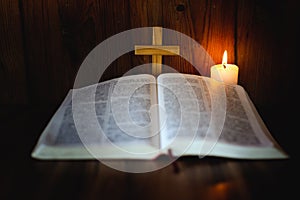 Candlelight provides light for Bible study Christian religious concepts, the crucifixion of faith and faith in God. Bible study