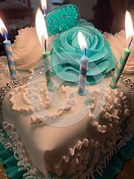 Candlelit Birthday Cake with Turquoise Roses