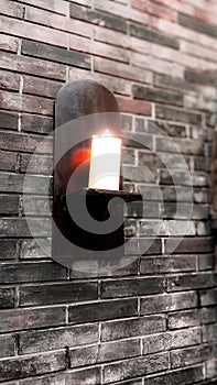 Candlelit Wall Sconce on Brick