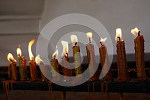 Candles with ancient magic letters burning to ward off bad luck