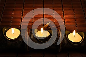 Candles on bamboo rug