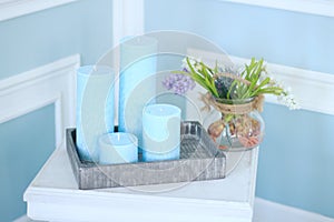 Candles on the bedside table in the bedroom.