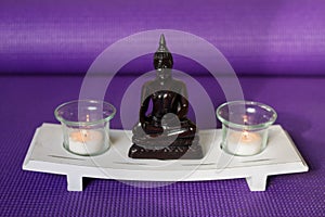 Candles and buddha in relaxation space