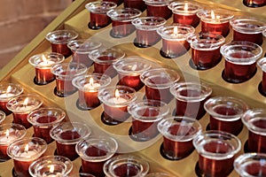 Illuminated church candles symbolizing faith and devotion