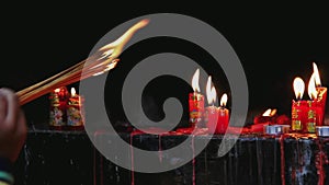 Candles burn in a Chinese Buddhist temple