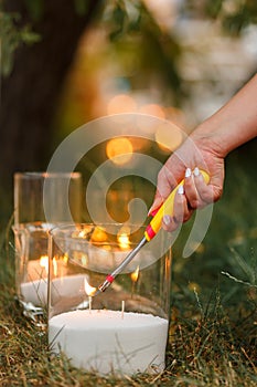 Candles burn in glass flasks