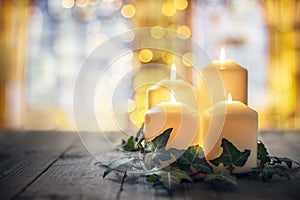 Candles burning in a church background