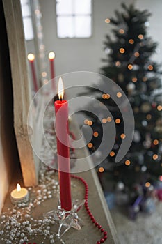 Candles Burning On Mantelpiece On Christmas Day photo
