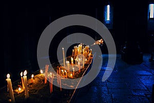 Candles burning in old Armenian traditional Christian  Church.