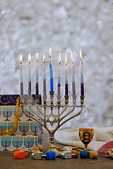 Candles burning in a traditional Jewish Hanukkiah menorah symbolizing Hanukkah holiday