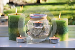 Candles burning on a windowsill