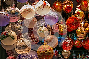 Candles, Christmas balls and other Christmas items for sale at one of the christkindlmarkt of Salzburg city in Austria