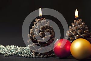Candles with christmas-tree decorations
