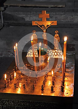 Candles and crucifix in church