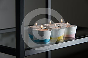 Candles in a differen colours concrete candle holders