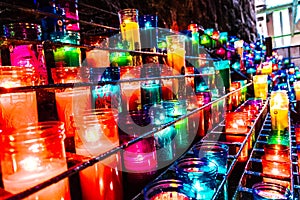 Candles of different colors lit photo