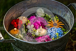Candles and flowers in water photo