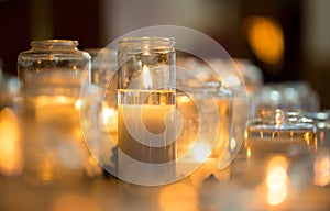 Candles in glas jar photo