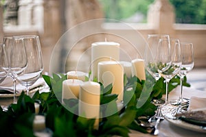 Candles and goblets on a decorated wedding table