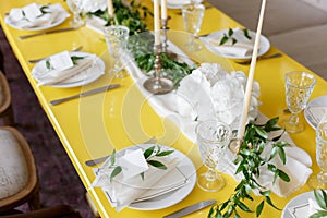 Candles and goblets on a decorated wedding table. selective focus