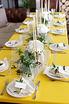 Candles and goblets on a decorated wedding table. selective focus