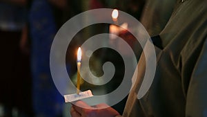 Candles in the hands of believers in the Russian Orthodox Church