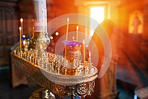 Candles and lamp close-up. Interior Of Orthodox Church In Easter. baby christening. Ceremony a in Christian . bathing