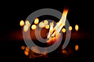 Candles and lights  on a black background with bokeh lights