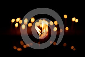 Candles and lights  on a black background with bokeh lights