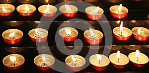 candles lit inside the place of worship to pray