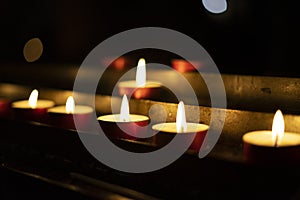 Candles lit red during a session of spiritualism. Concept of occultism